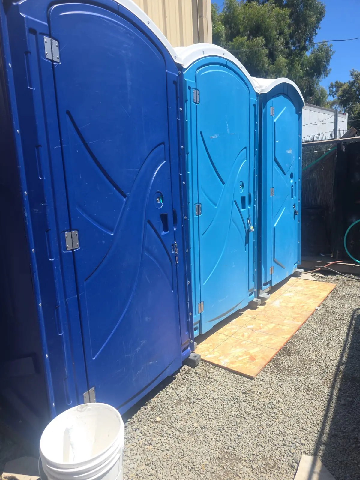 Portable restrooms set up on site for an outdoor event